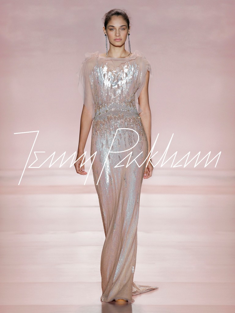 A shot from Jenny Packham's runway showing the pink pearl gown on a model. The model is mid walk, which gives the dress a lovely movement.