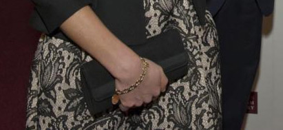 Kate's black bag and gold bracelet. Image via Majesty Magazine Twitter