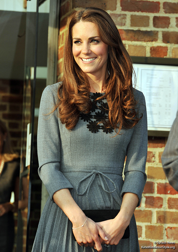 Duchess Kate wore an Orla Kiely dress, a Tiffany bracelet, carried a mystery clutch bag.