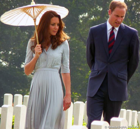 Kate holds a parasol while touring the graves at Kranji war cemetery Kate holds a parasol while touring the graves at Kranji war cemetery