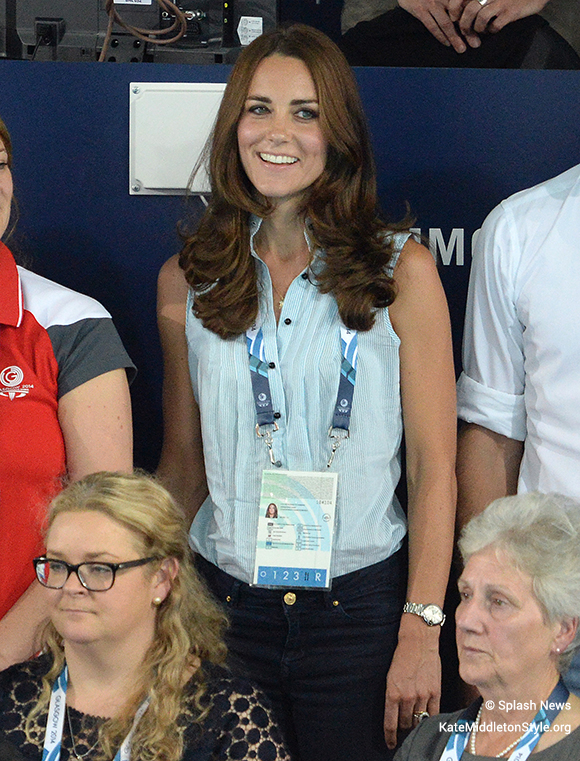 Kate in the sleeveless blue and white stripe blouse