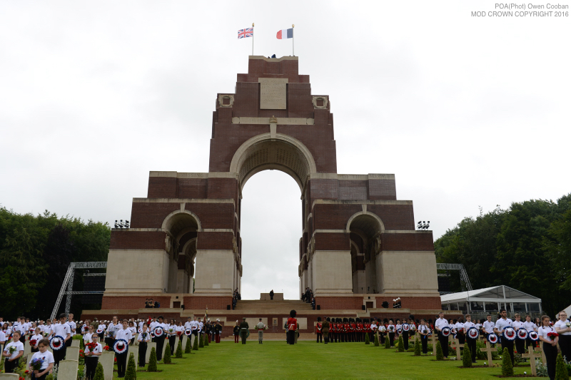 Image shows the Thiepval Memorial and the hundreds of school children from the UK and France who attended the service. Members of the Royal Family have joined the Prime Minister and representatives of allies and former enemies, together with hundreds of Armed Forces personnel and 10,000 guests to mark the centenary of the Battle of the Somme at an international service of commemoration in France.Representatives of all the regiments that took part in the conflict 100 years ago attended the service at the Thiepval Memorial along with a Guard of Honour from the Irish Guards and guns of the King’s Troop Royal Horse Artillery.Servicemen and women took part in the service, reading moving accounts of the battle from those who went over the top on the 1 July 1916.The King’s Troop Royal Horse Artillery fired their guns to mark the end of a period of silence, and wreaths were laid at the Cross of Sacrifice.The guns are 13 Pounder Quick Fire guns, and saw service in the First World War. art in commemorative services in both Thiepval and Manchester.
