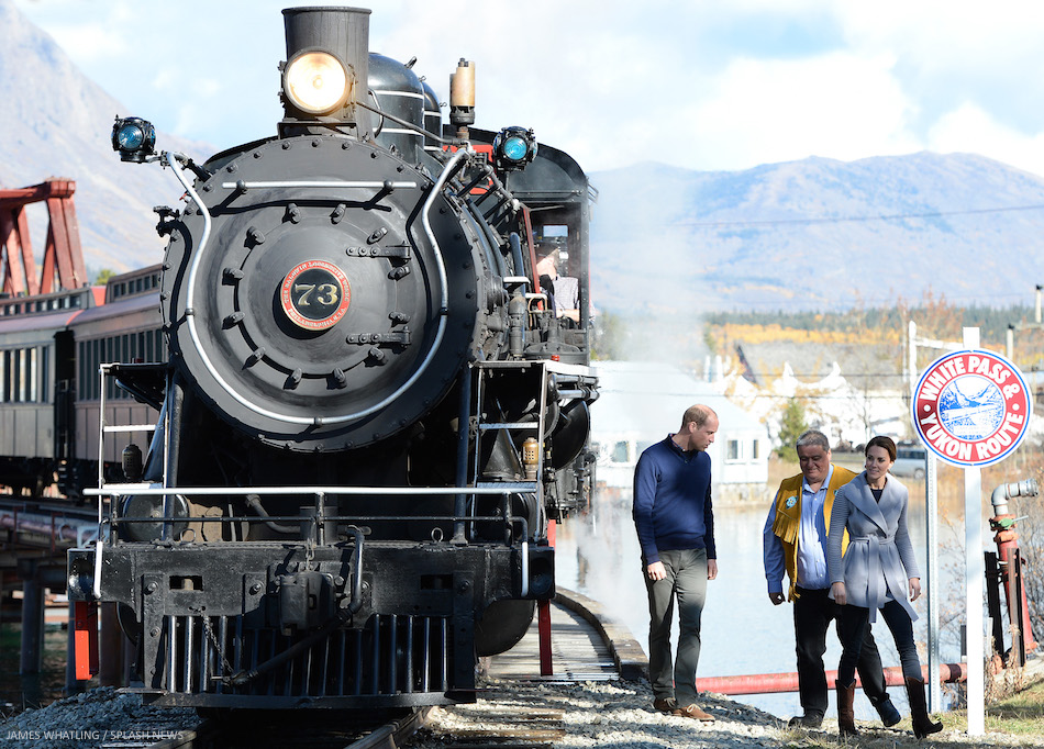 The Duke and Duchess of Cambridge cling on as they negotiate a tricky bridge, after taking a look at a steam train on a visit to Carcross, Yukon, Canada, on the 28th September 2016.