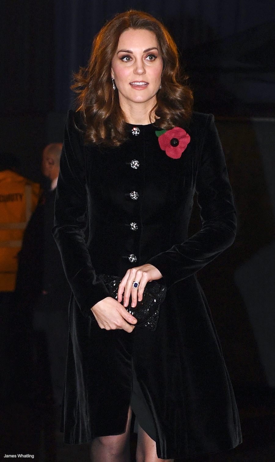 Kate Middleton in a black velvet coat holding her vintage black beaded clutch bag by Magid