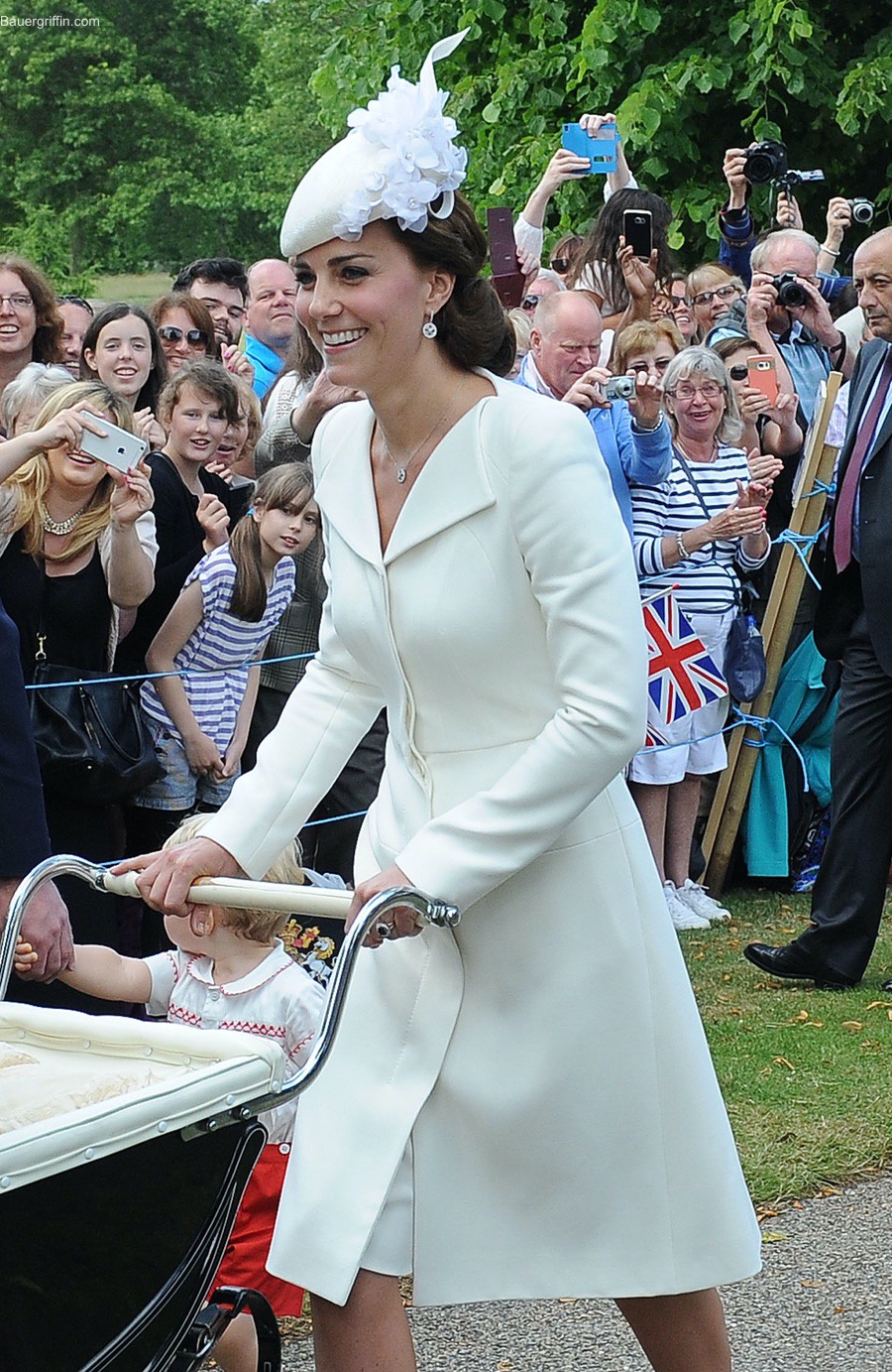 Kate Middleton at Princess Charlotte's christening wearing a cream Alexander McQueen coat