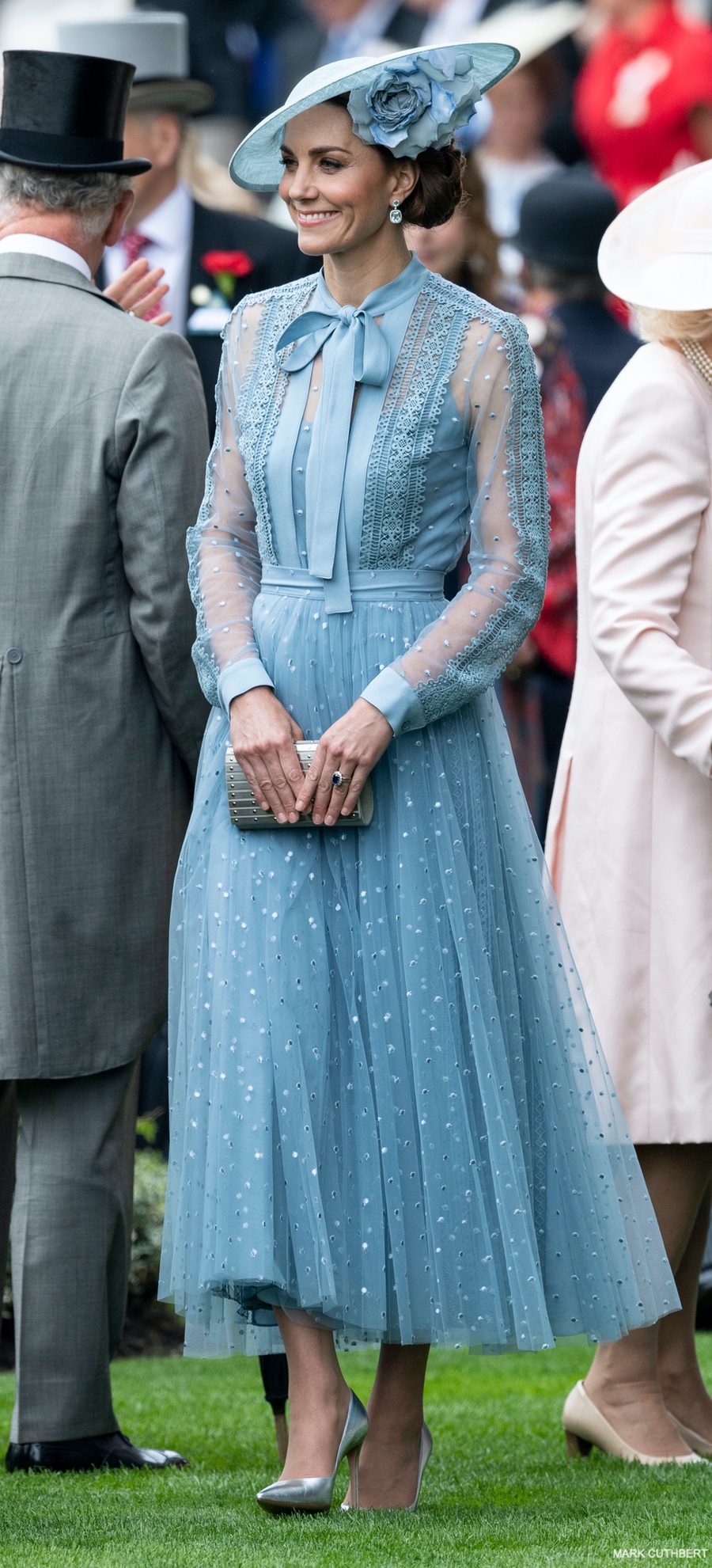 The Duchess of Cambridge pictured in a blue outfit Elie Saab, matching hat by Philip Treacy and silver shoes by Gianvito Rossi.