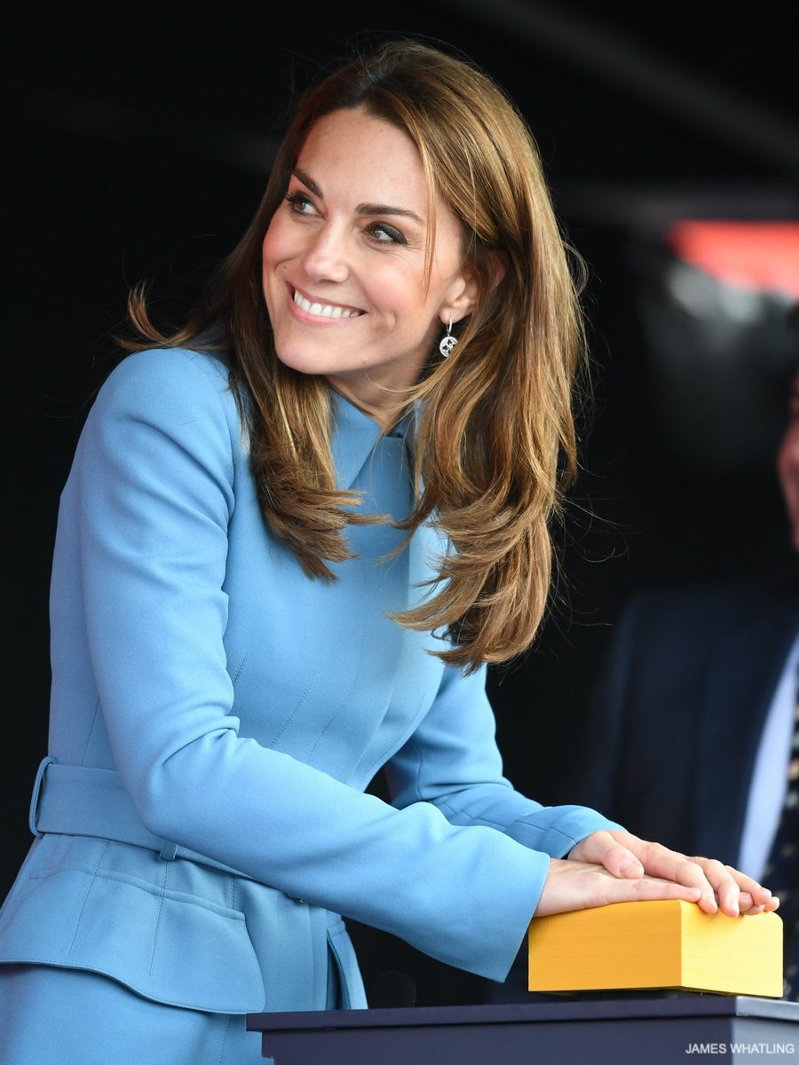 Kate hits the button to christen the ship