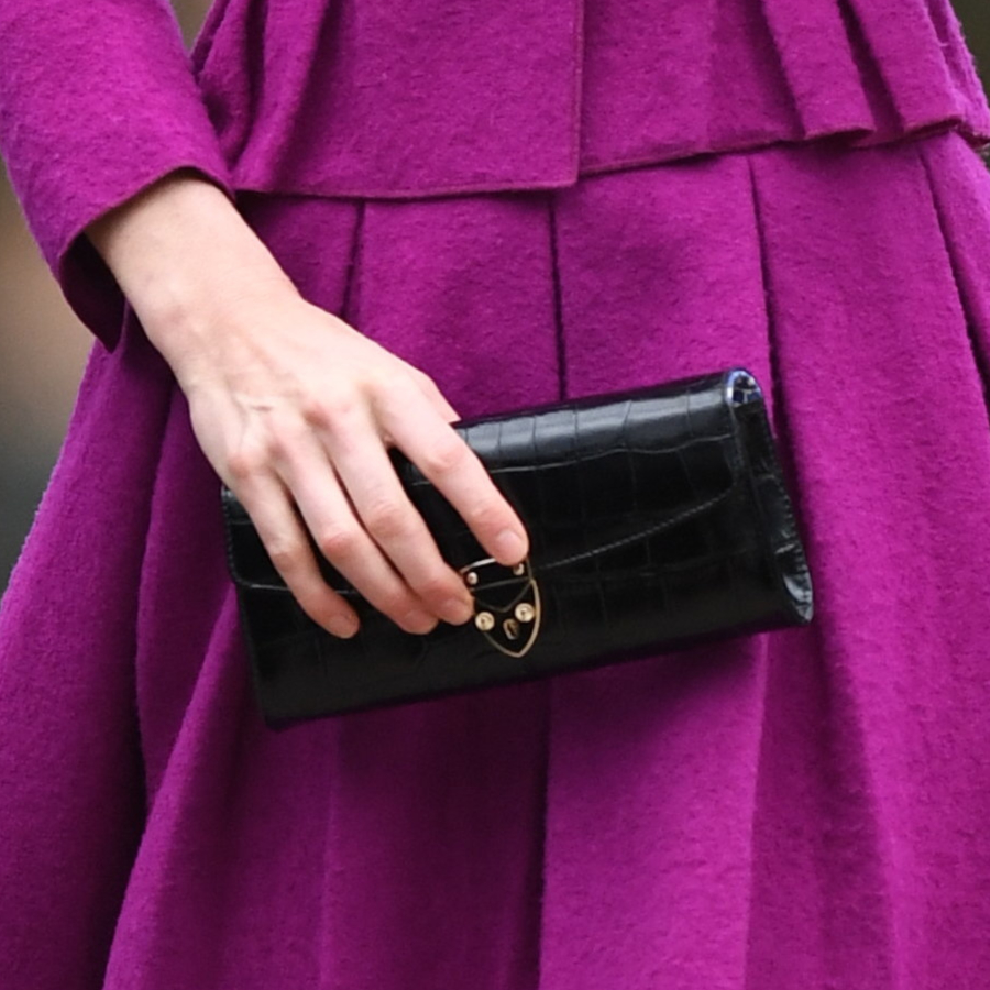 Kate Middleton carrying the Aspinal of London Blue Heart Clutch