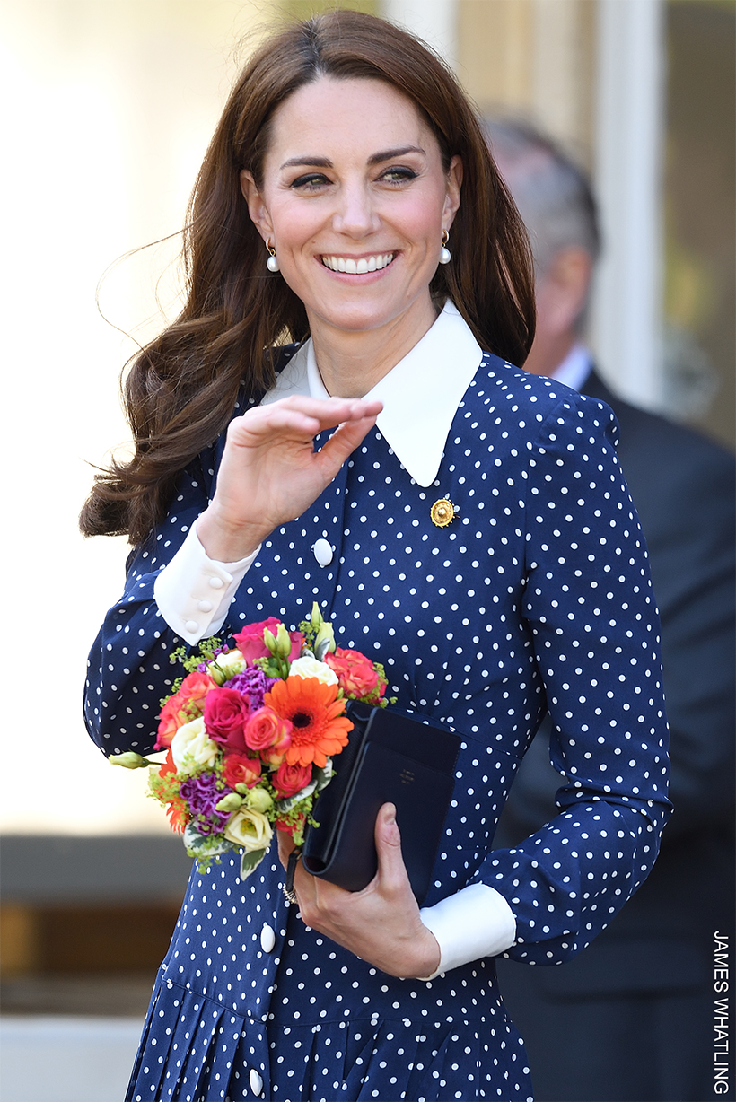 Kate Middleton wearing a spotty navy dress