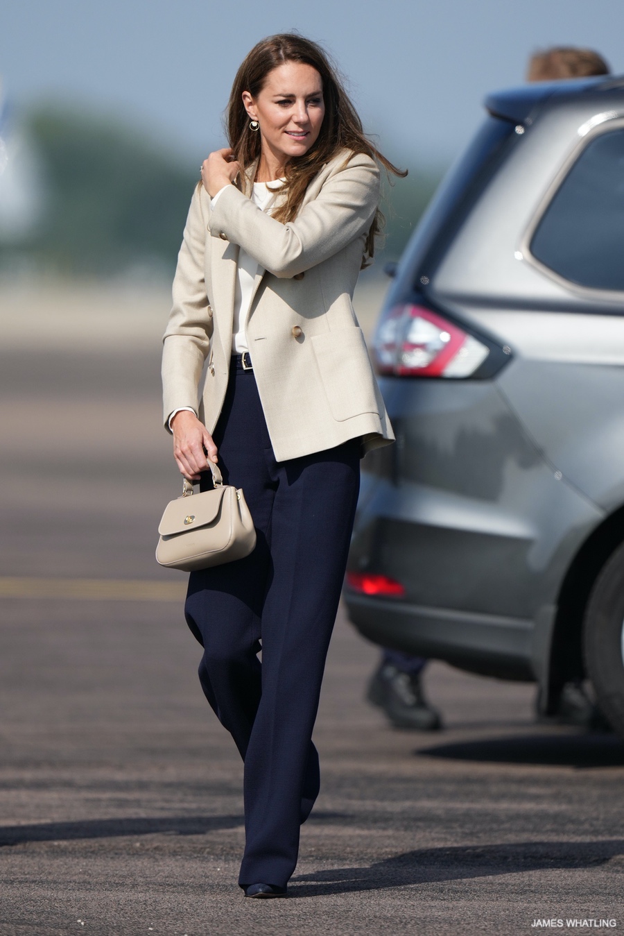 Kate Middleton carrying the taupe Tusting Mini Holly bag during a visit to RAF Brize Norton in 2021