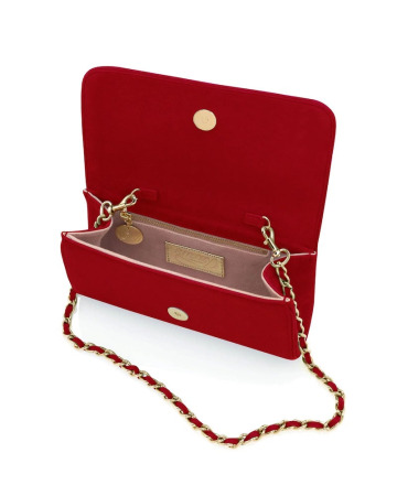 A side-angle view of the Emmy London Natasha clutch in red suede, showcasing its structured silhouette and seamless suede finish.