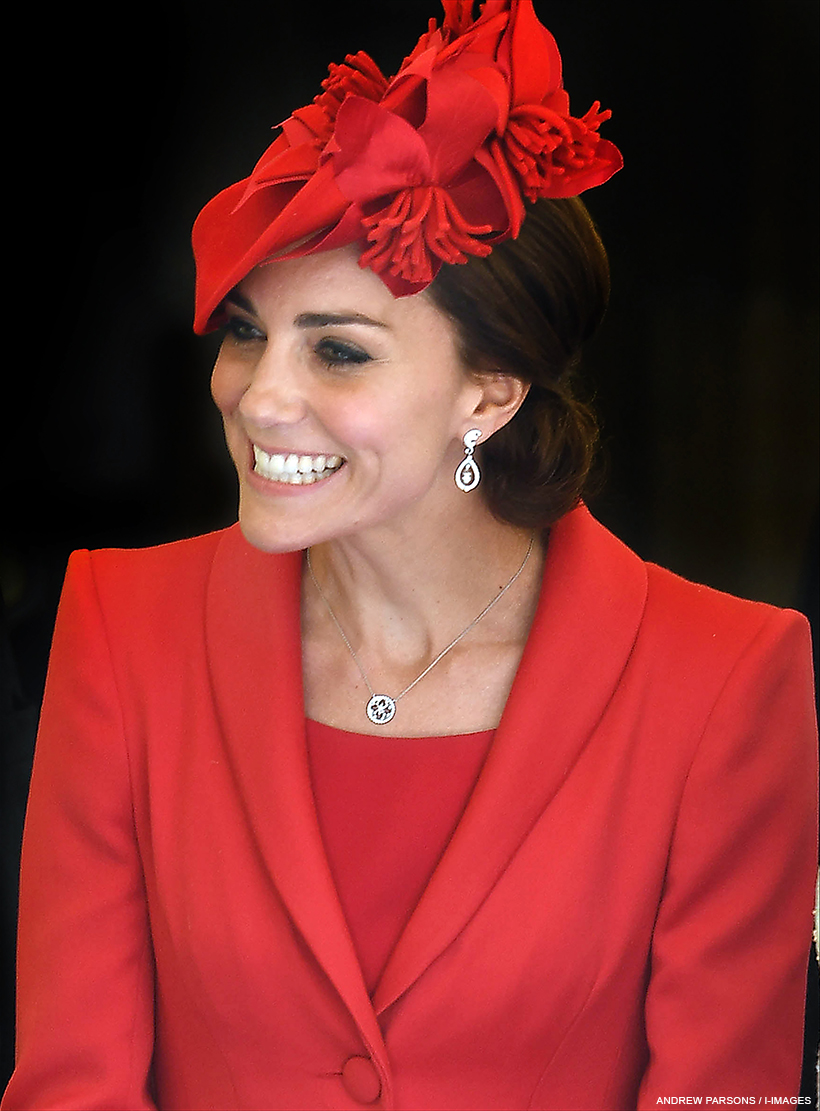 Princess of Wales wearing formal red clothing and hat. She is wearing the white gold Empress necklace.