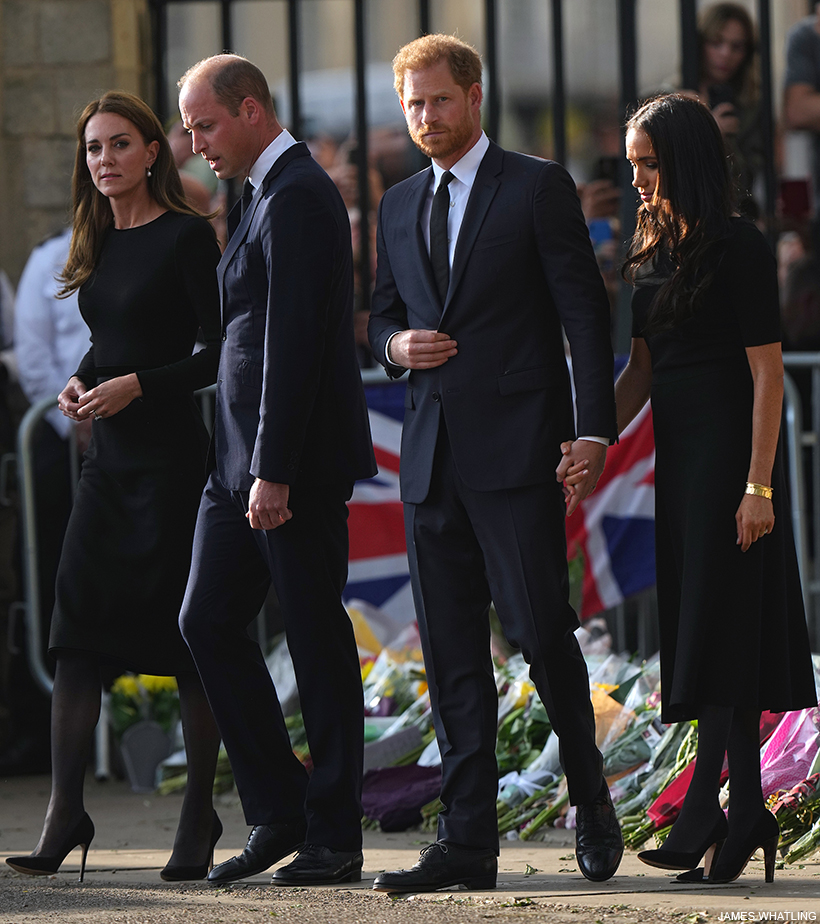 The four royals dressed in dark, sombre colours. 
