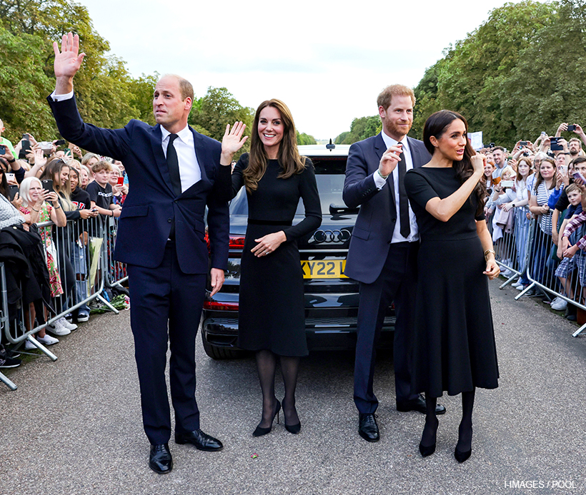 William, Kate, Meghan and Harry wave goodbye after their walkabout. 