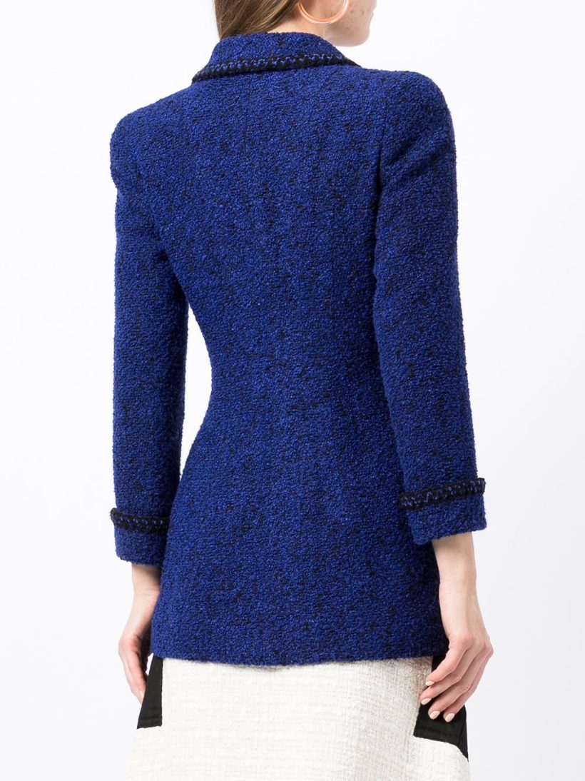 Back view of a model wearing the Chanel jacket in cobalt blue