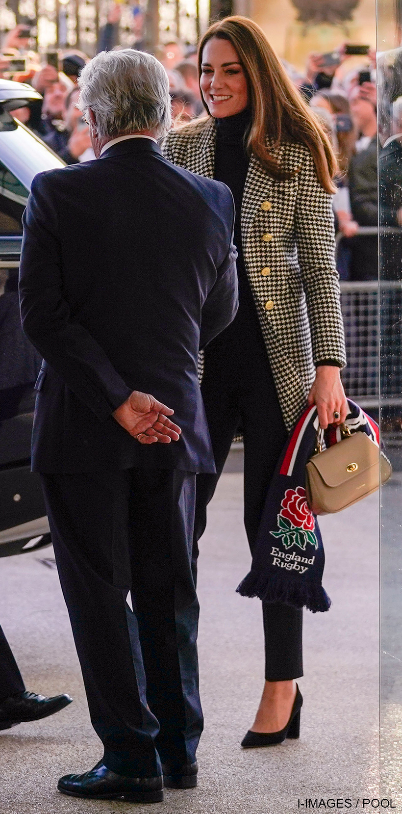 Kate Middleton carrying the taupe Tusting Mini Holly bag at the England v Wales rugby match at Twickenham in 2022