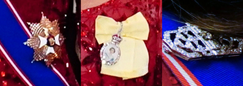 The Princess of Wales's insignia - a blush sash, star badge and yellow ribbon.  Plus, Kate's silver coloured art deco brooch.