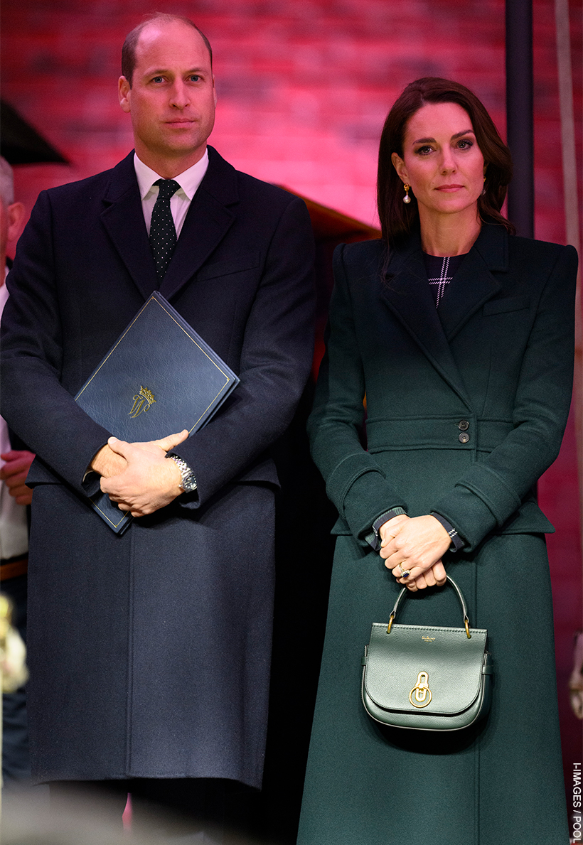 Kate Middleton stood with Prince William. Kate is holding the Mulberry Amberley Satchel in her hand