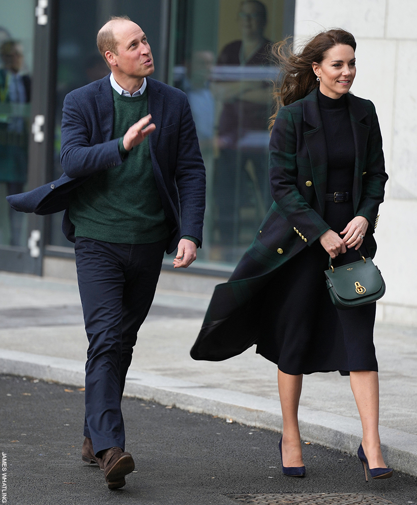 Kate Middleton wearing a super chic tartan coat with a coordinating outfit underneath.