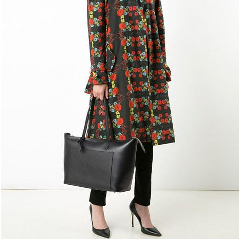Model holding the black Smythson bag