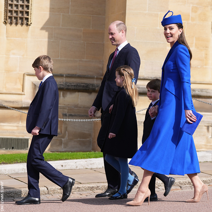 Kate Middleton - walking with her family - wearing a cobalt blue Catherine Walker coat dress and Lock & Co. pillbox hat at Easter service in Windsor, 2023.