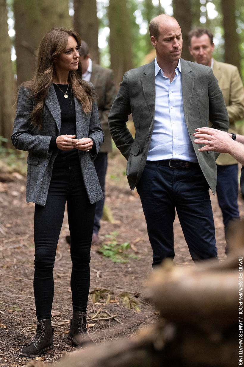 William and Kate listen intently as a teacher talks about the benefits of forest school.