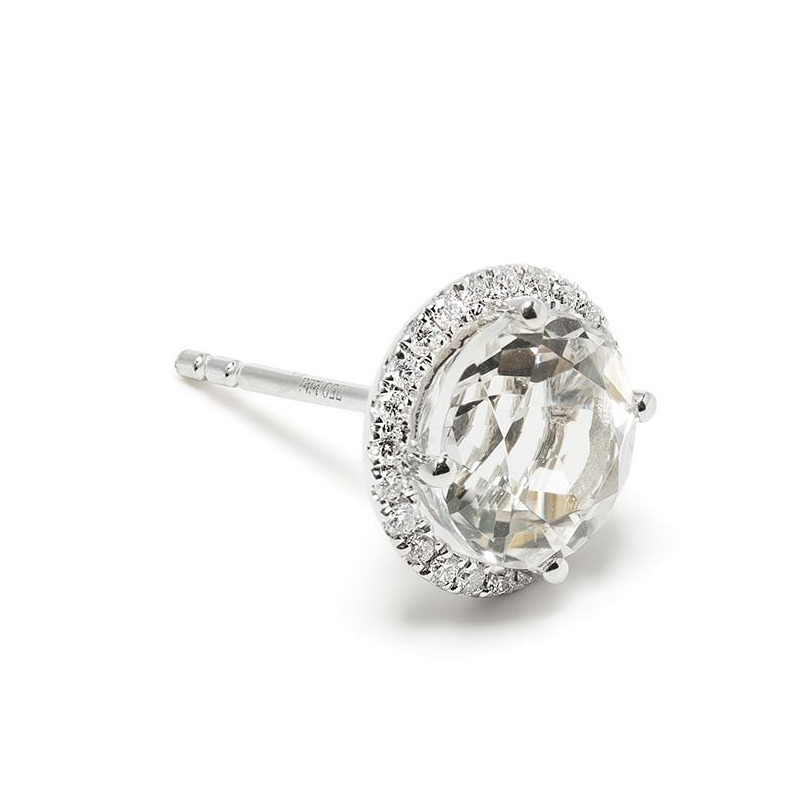 A sideways shot of the white topaz and diamond earrings, which are set in white gold.