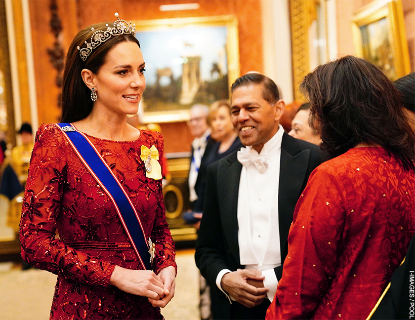 The Princess of Wales wears the Lotus Flower Tiara on top of her brown slicked back hair. She pairs the gem with another red dress, this time featuring intricate beading.