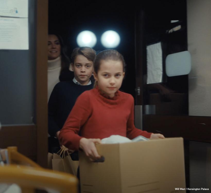 Kate, George and Charlotte carrying boxes into The Baby Bank.