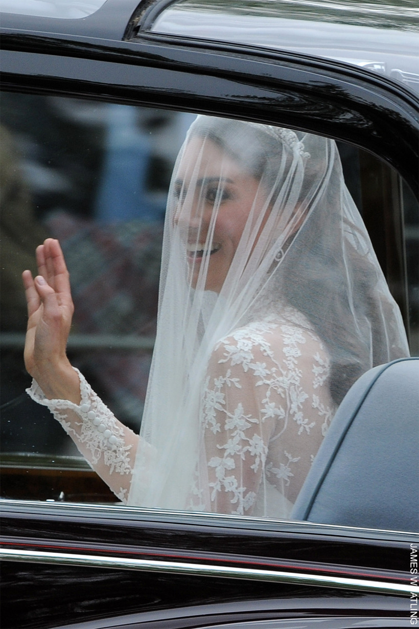 The bride going into the venue on her wedding day