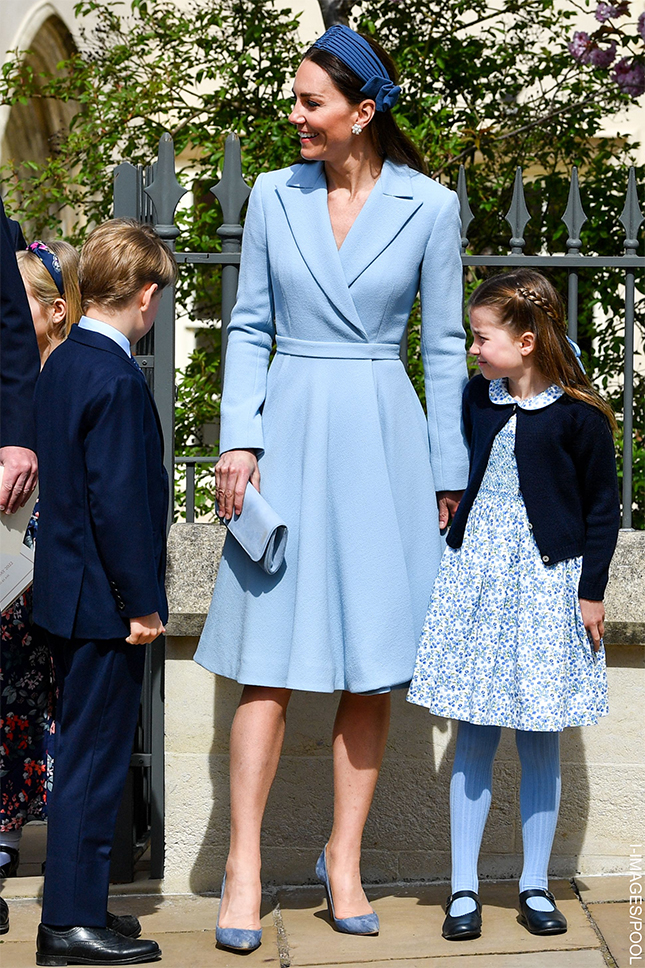 Kate Middleton wearing a pastel blue Emilia Wickstead coat dress with Jane Taylor headband at Easter service in 2022, accompanied by Prince George and Princess Charlotte.
