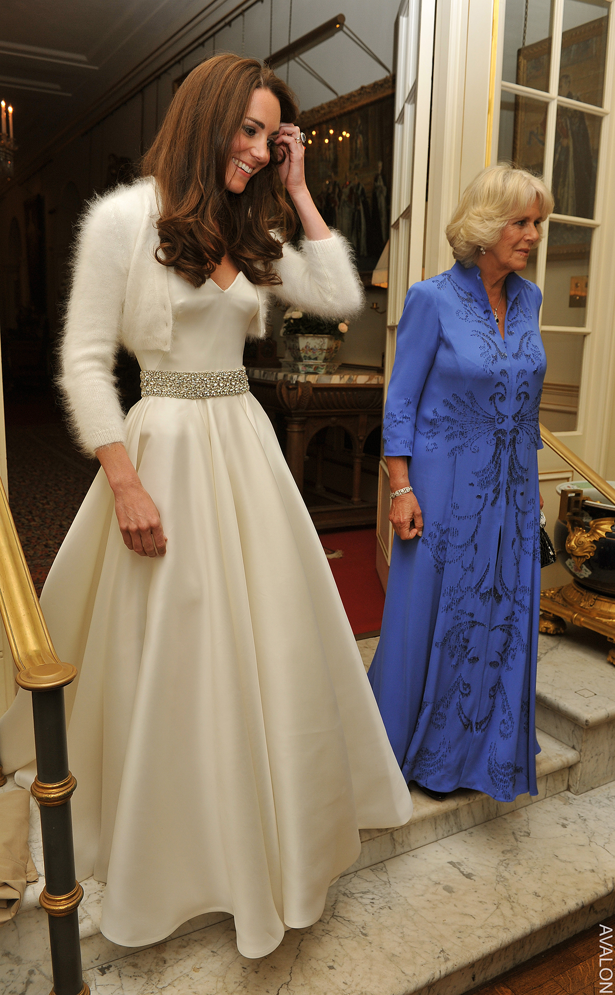 Kate Middleton changed into her second wedding dress for the evening reception at Buckingham Palace. The smooth dress featured a strapless sweetheart neckline, a diamond belt and a full, flowing skirt.