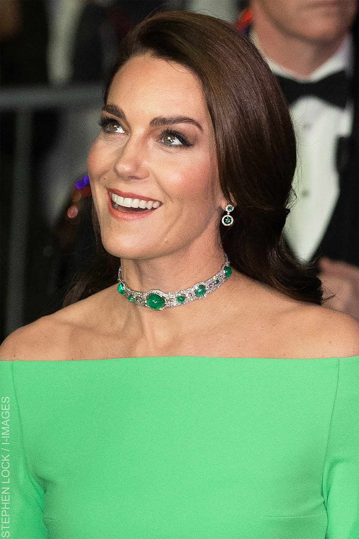 Detail of Kate Middleton's emerald-and-diamond choker and glossy waves, styled with her bright green Earthshot Awards gown.