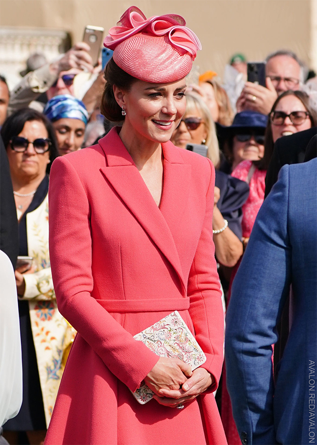 Kate Middleton in a pink coat holding a vintage floral beaded clutch by Josef