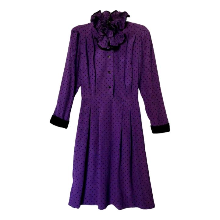 Purple high ruffled “pie-crust” collar dress with black polka dots, by Oscar de la Renta