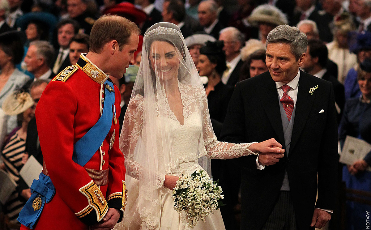 William and Kate's Wedding inside Westminster Abbey. The couple smile as the nuptials takes place.