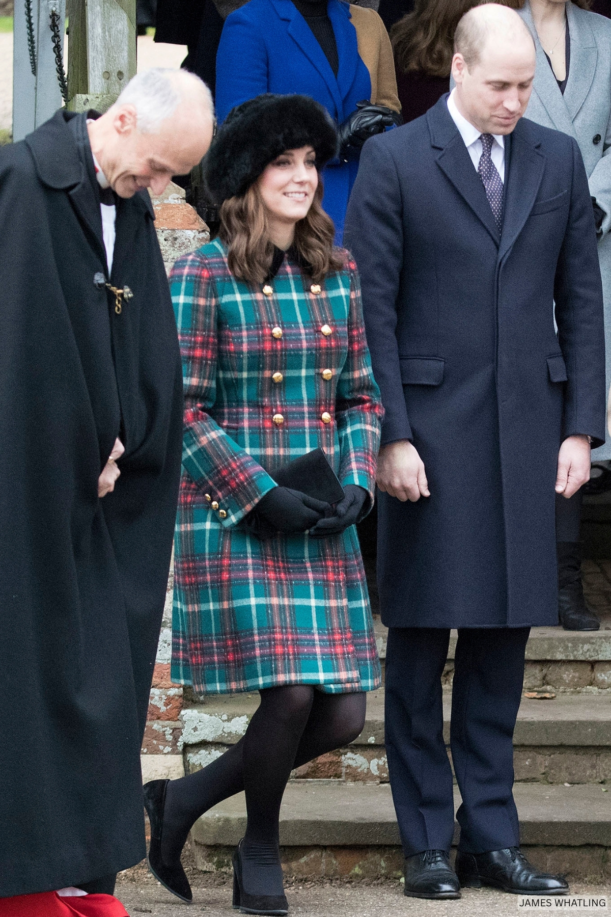 Kate Middleton Curtises wearing a red or green tartan coat