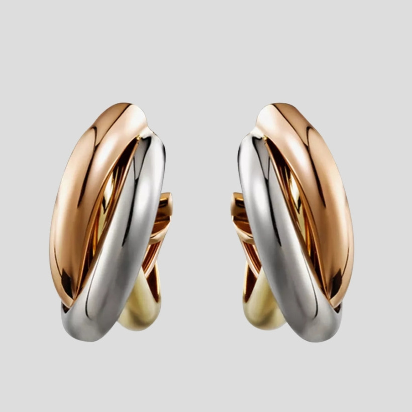 Kate Middleton wearing Cartier Trinity three-colour gold hoop earrings with Gianvito Rossi pumps