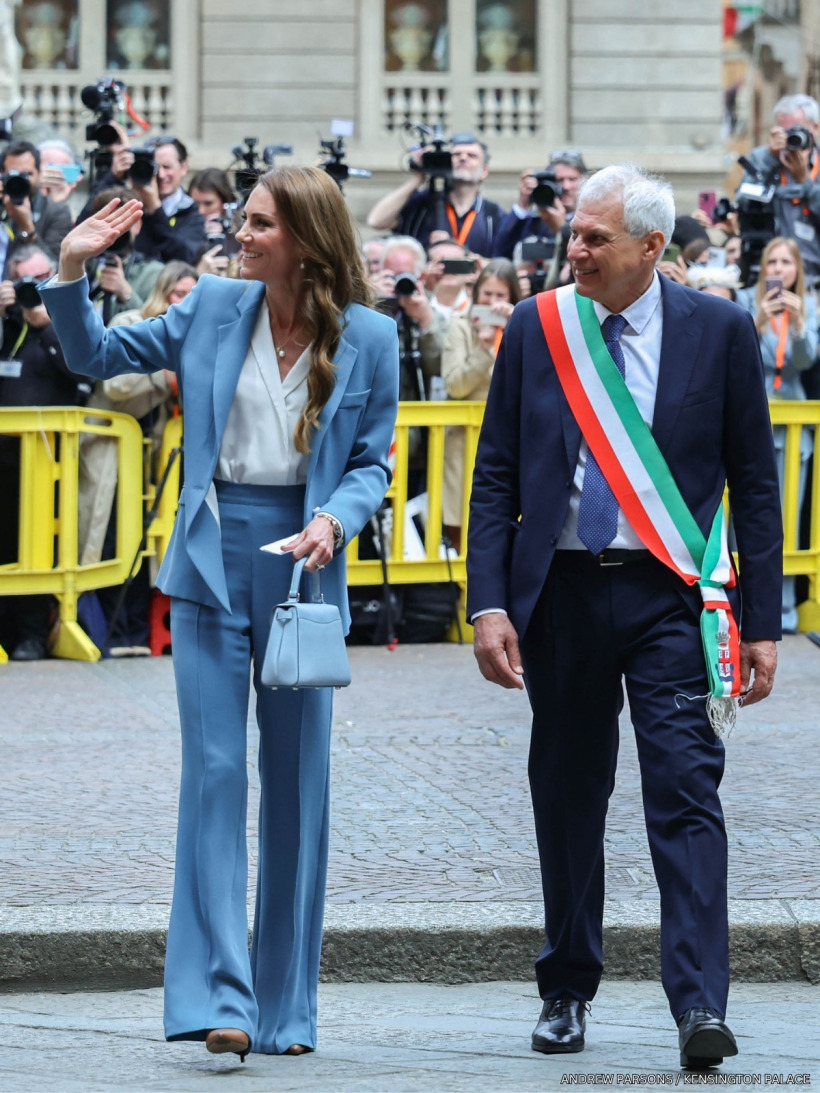 The Princess of Wales smiling and waving during her visit to Reggio Emilia, Italy as she walks alongside the city's mayor.