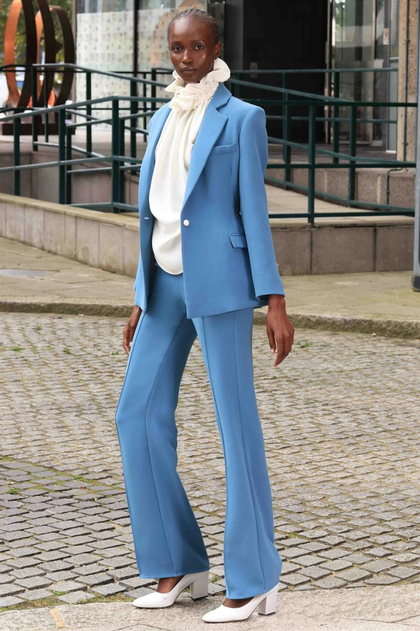 The Edeline Lee Lola jacket and Averill trousers suit shown on the model in cornflower blue