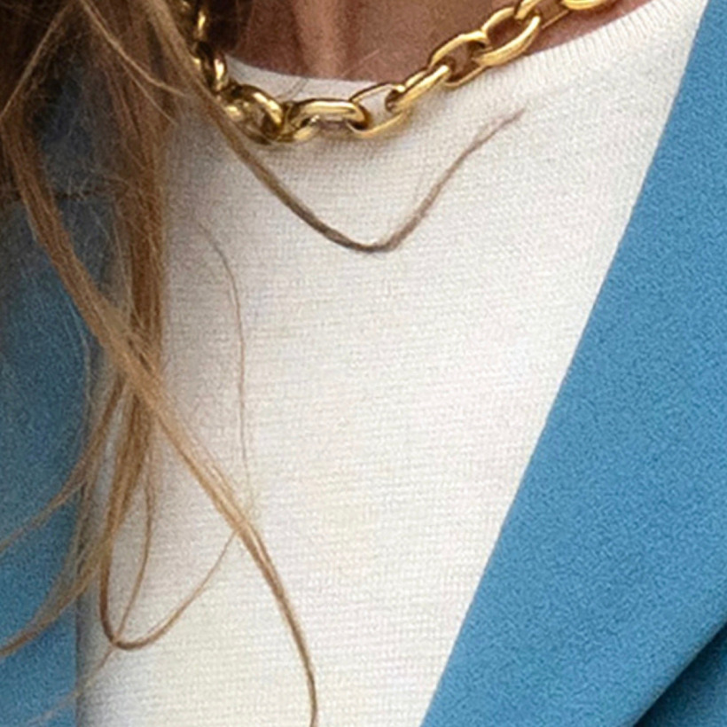 Kate Middleton wearing a white lightweight knit sweater